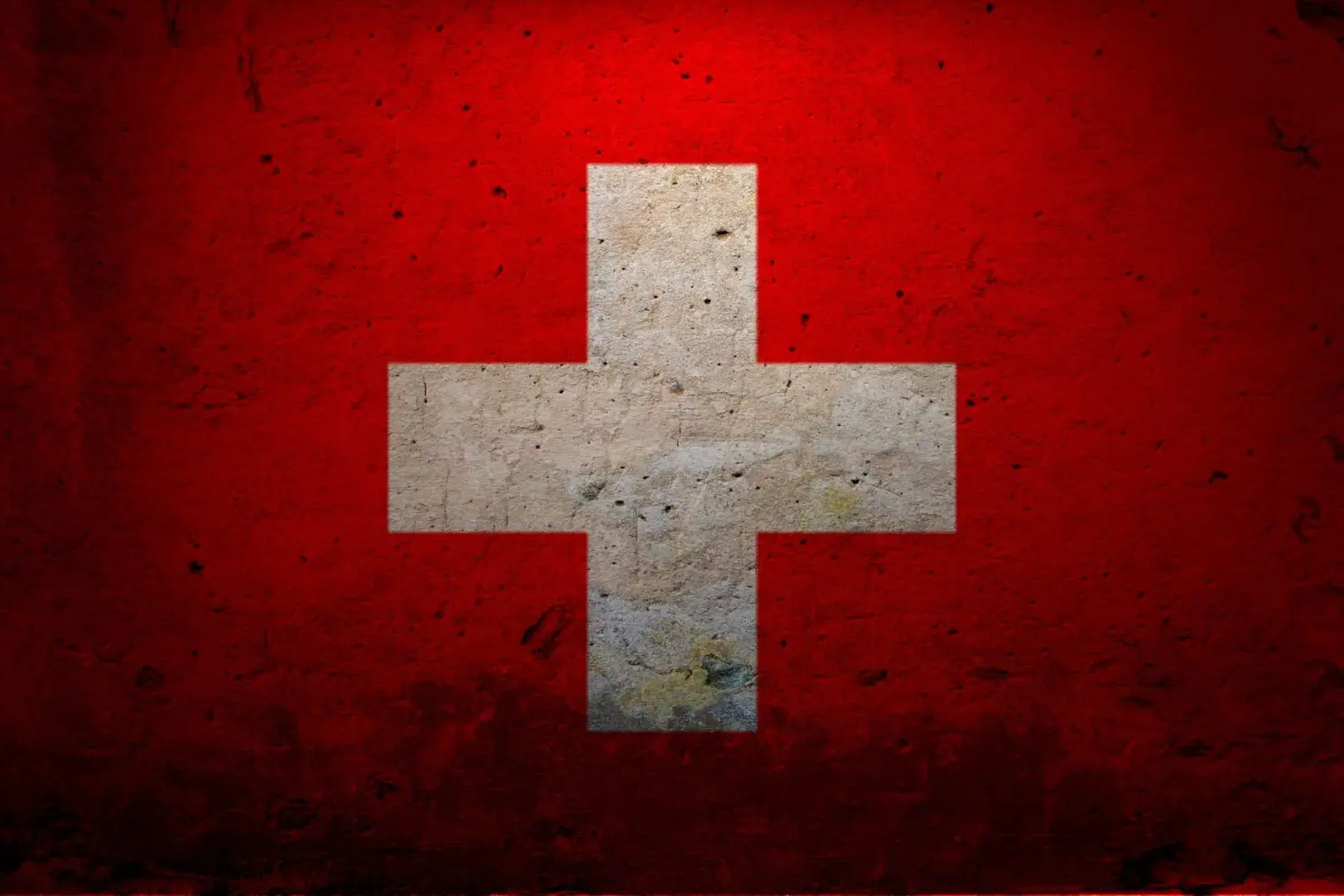 A white plus sign on a red background. This is a symbol for medicine.